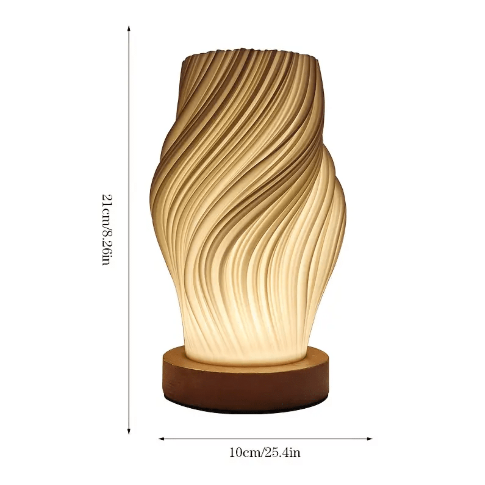 Compacte design tafellamp met golvend patroon, warm licht en een hoogte van 21 cm.